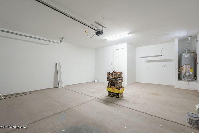 garage featuring water heater and a garage door opener