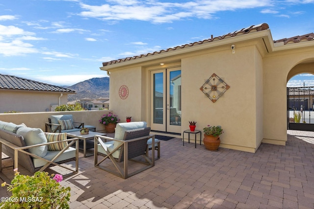 view of patio / terrace featuring a mountain view and an outdoor living space