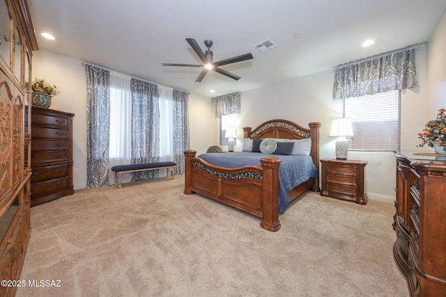 bedroom with ceiling fan, recessed lighting, visible vents, and light colored carpet