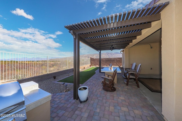 view of patio featuring a fenced backyard, a pergola, and area for grilling