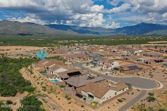 drone / aerial view with a residential view and a mountain view