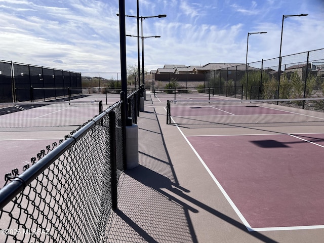 view of sport court with fence