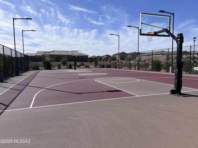 view of sport court featuring community basketball court and fence