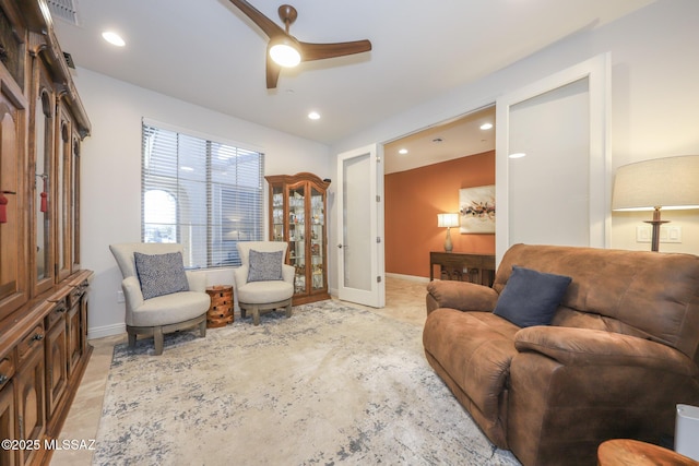 living area featuring ceiling fan, baseboards, visible vents, and recessed lighting