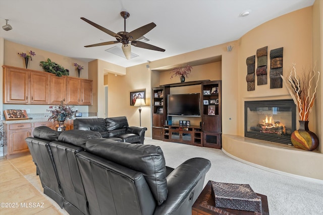 living room with ceiling fan and light carpet