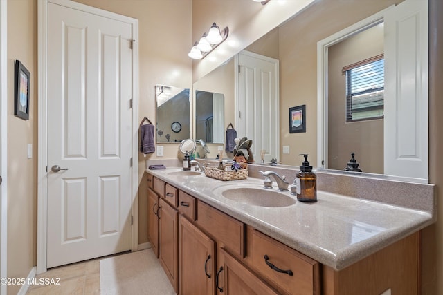 bathroom with tile patterned flooring and vanity