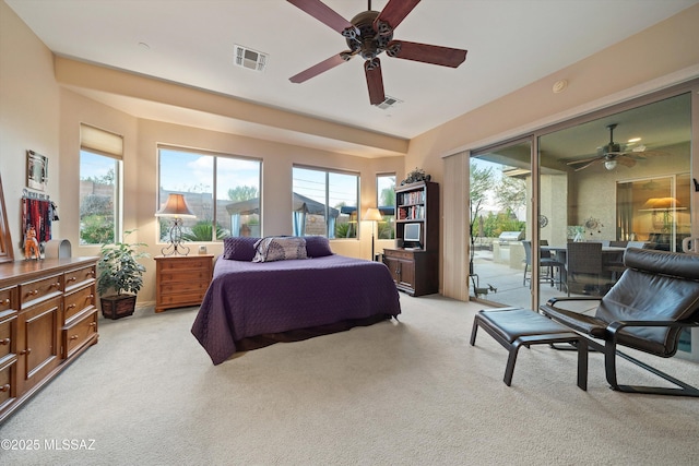 bedroom featuring light carpet, access to exterior, multiple windows, and ceiling fan