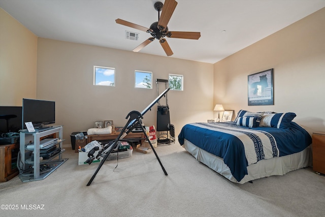 bedroom featuring light carpet and ceiling fan