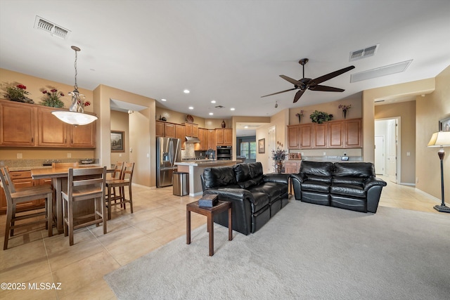 living room with light tile patterned floors and ceiling fan