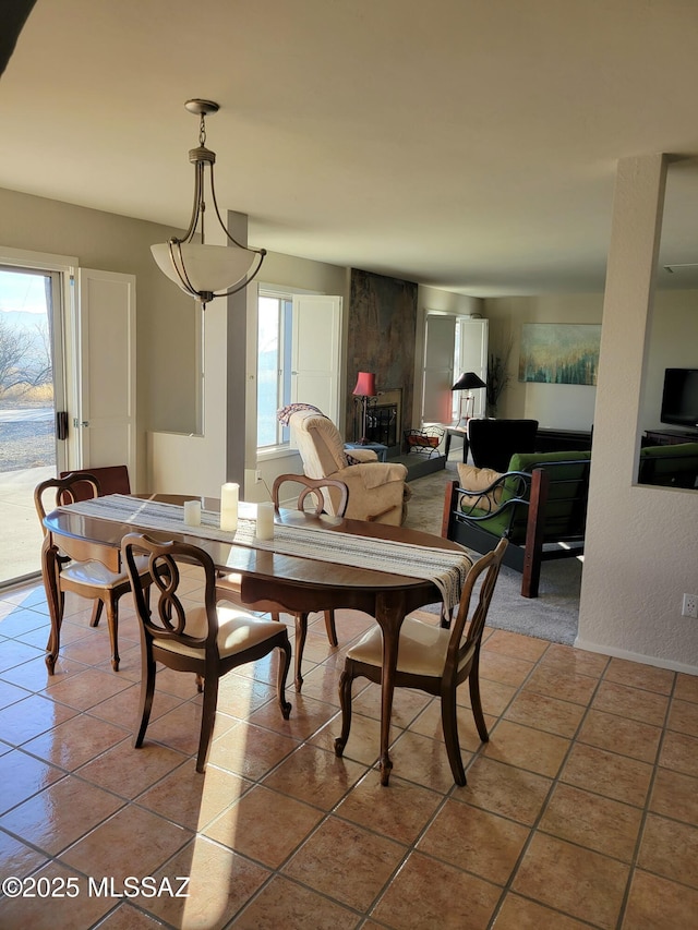 dining room featuring light tile patterned floors