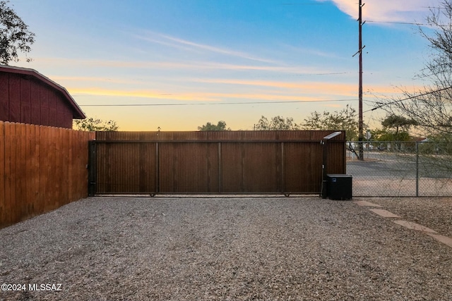 view of gate at dusk