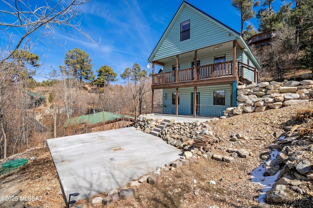 back of property with a patio