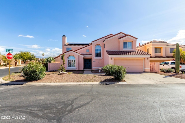 mediterranean / spanish-style house featuring a garage