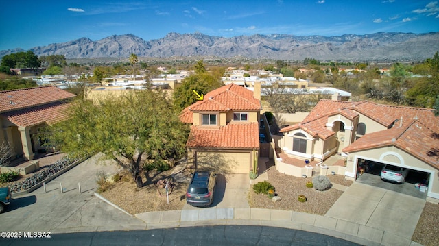 birds eye view of property featuring a mountain view