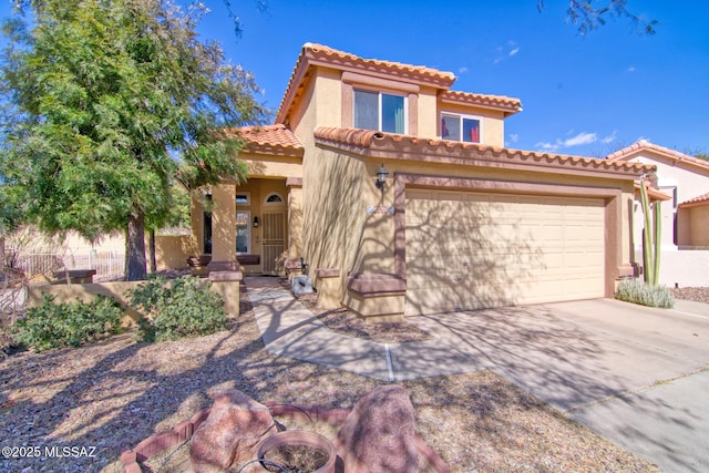 mediterranean / spanish home with a garage, driveway, a tile roof, fence, and stucco siding