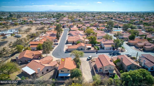 birds eye view of property featuring a mountain view and a residential view