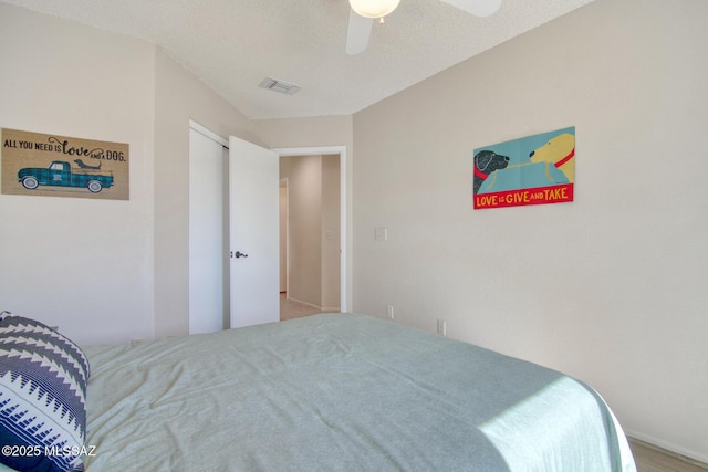 bedroom with ceiling fan and visible vents