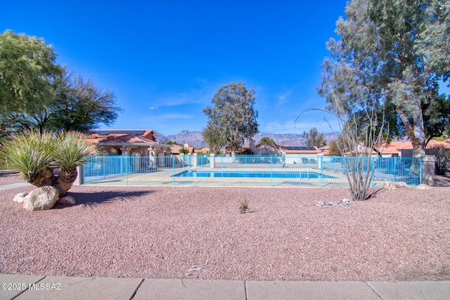 community pool featuring fence