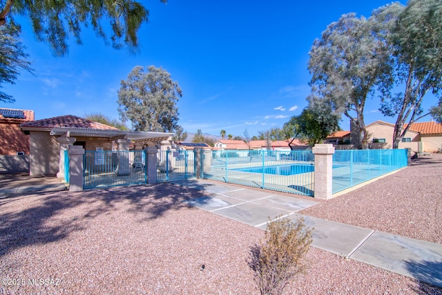 community pool with a gate and fence