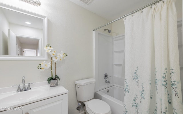 full bath featuring shower / bath combo, vanity, and toilet