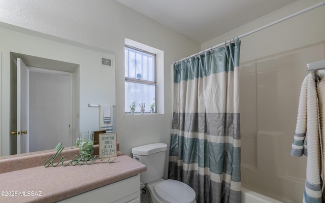 full bath featuring toilet, shower / bath combination with curtain, vanity, and visible vents