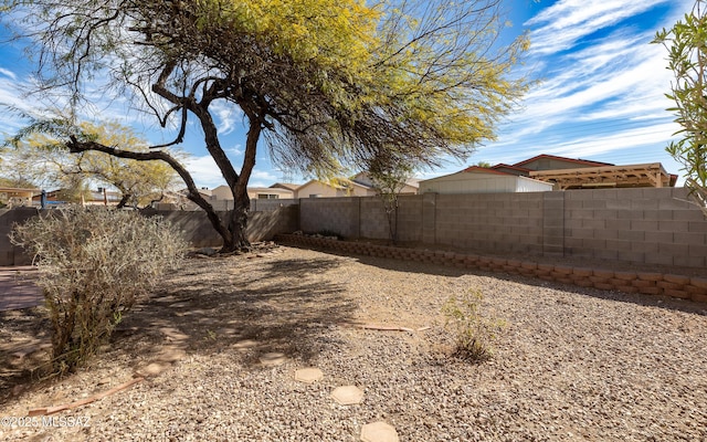 view of yard with a fenced backyard