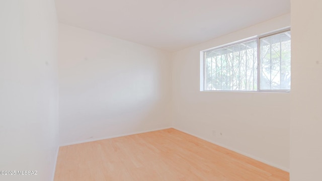 unfurnished room featuring light wood-type flooring