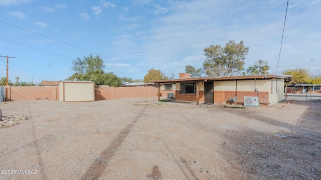 view of front of home with a storage unit