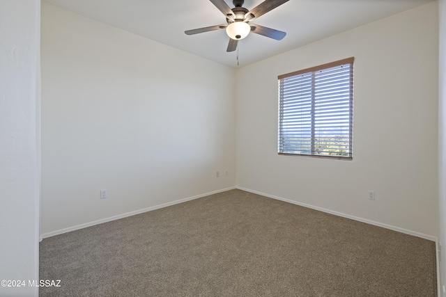 carpeted empty room featuring ceiling fan