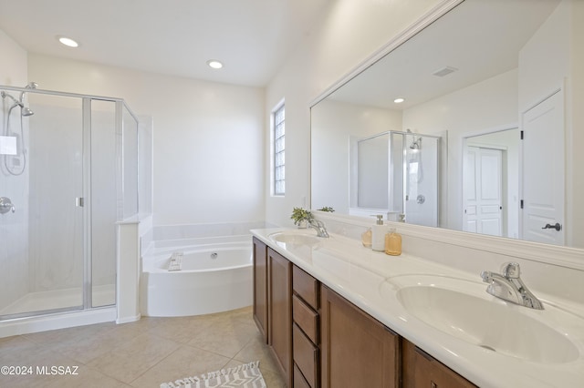 bathroom with tile patterned flooring, vanity, and independent shower and bath