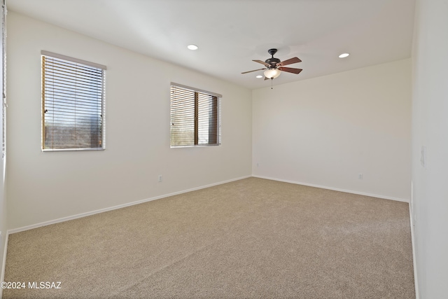 carpeted empty room with ceiling fan