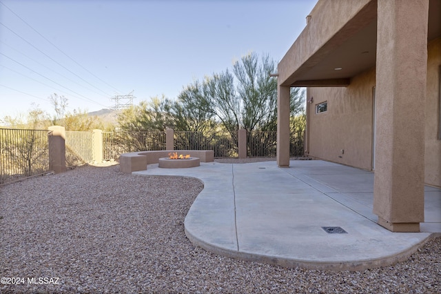 view of patio with a fire pit