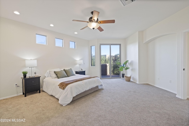 carpeted bedroom featuring access to outside and ceiling fan