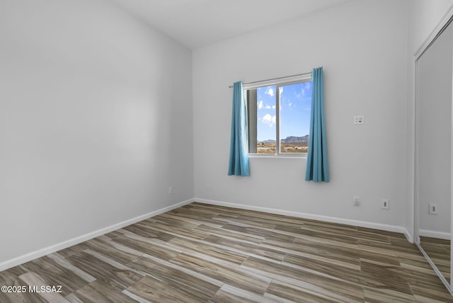 empty room featuring hardwood / wood-style floors