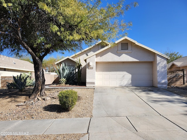 ranch-style home with a garage