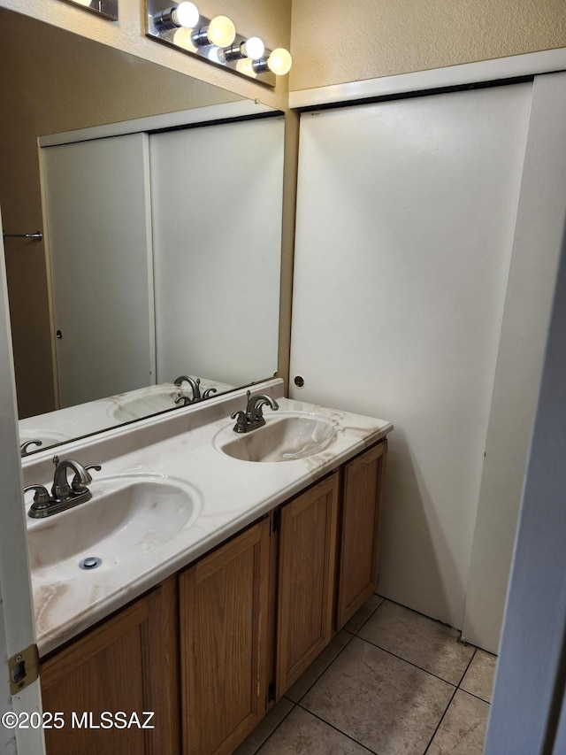 bathroom featuring vanity and tile patterned flooring