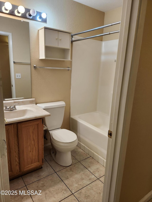 full bathroom featuring vanity, toilet,  shower combination, and tile patterned flooring