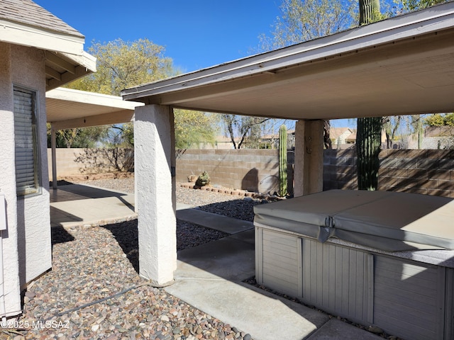 view of patio / terrace featuring a hot tub