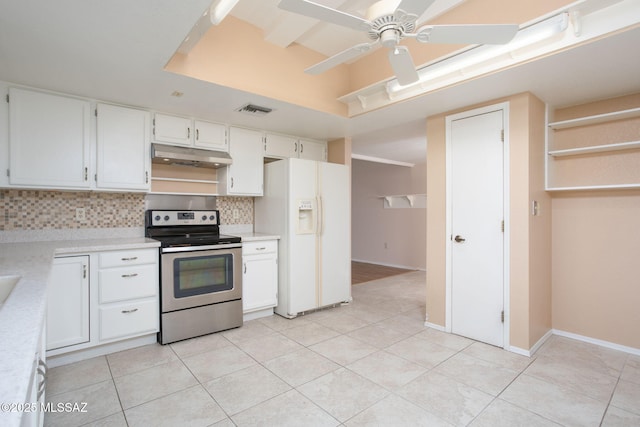 kitchen featuring under cabinet range hood, visible vents, electric stove, light countertops, and white fridge with ice dispenser