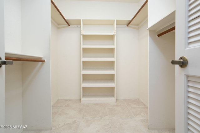 spacious closet with tile patterned flooring