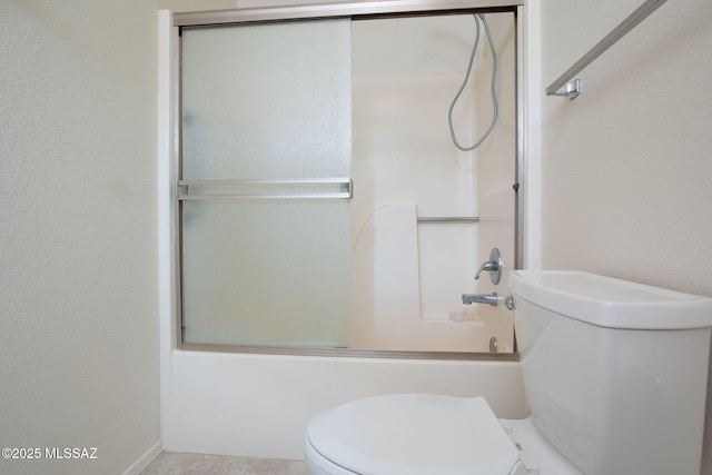 full bathroom with toilet and enclosed tub / shower combo