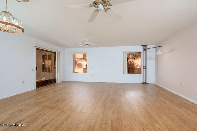 unfurnished living room featuring light wood-style flooring and baseboards