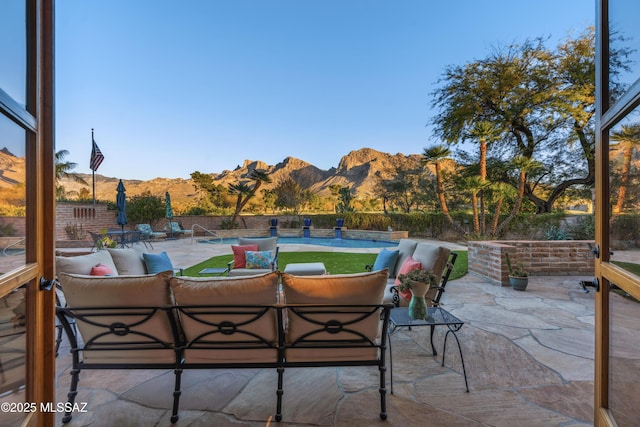 view of patio / terrace with a mountain view and outdoor lounge area