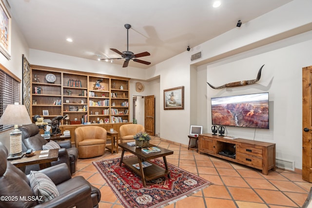 tiled living room featuring ceiling fan