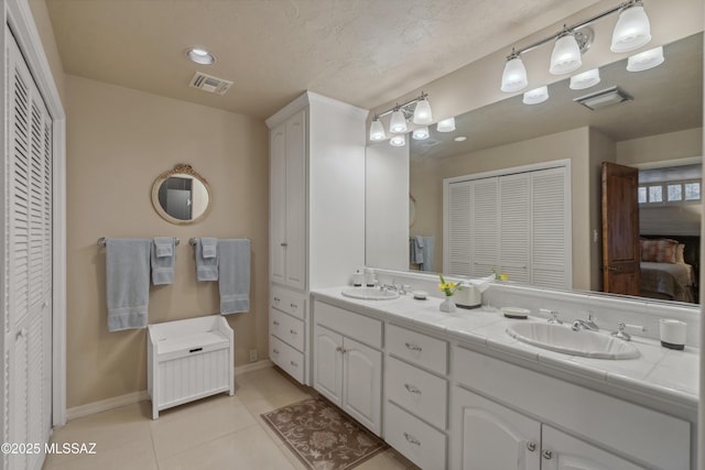 bathroom featuring vanity and tile patterned flooring