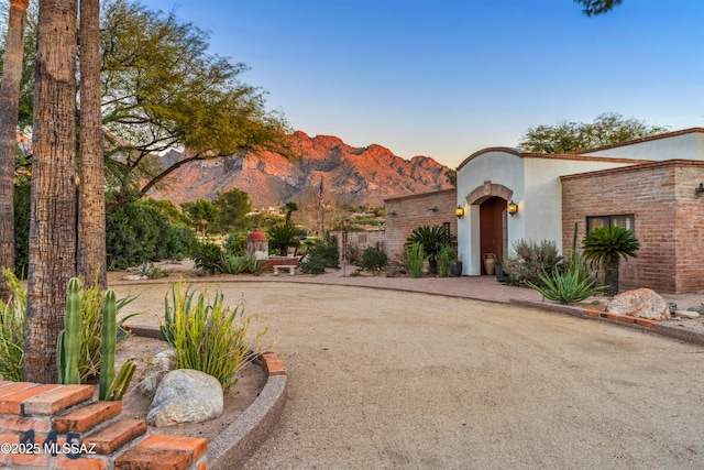 view of front of property with a mountain view