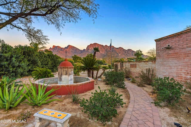 yard at dusk with a mountain view