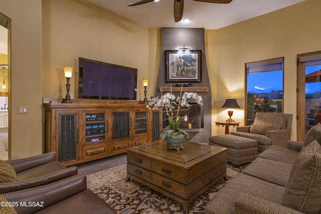 tiled living room featuring a ceiling fan