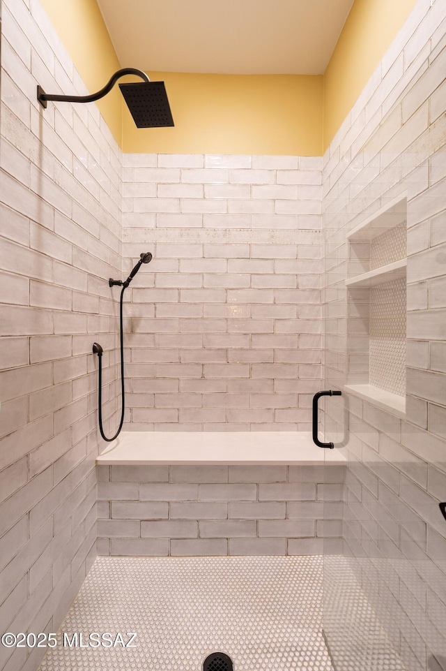 full bath with a tile shower