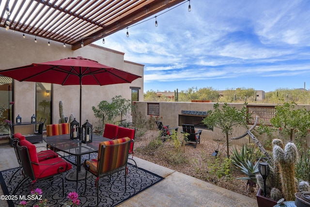 view of patio / terrace with outdoor dining space and a pergola